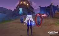 It's this blue-scarfed statue (Image via HoYoverse)